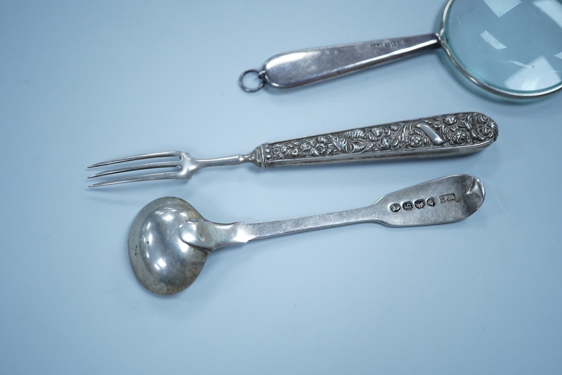 Two William IV silver fiddle pattern condiment spoons, both London 1831, a Victorian silver gilt ear wax spoon(lacking handle), two other silver spoons, a small white metal fork and a silver handled magnifying glass.